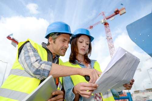 Construction manager and engineer working on building site Construction manager and engineer working on building site