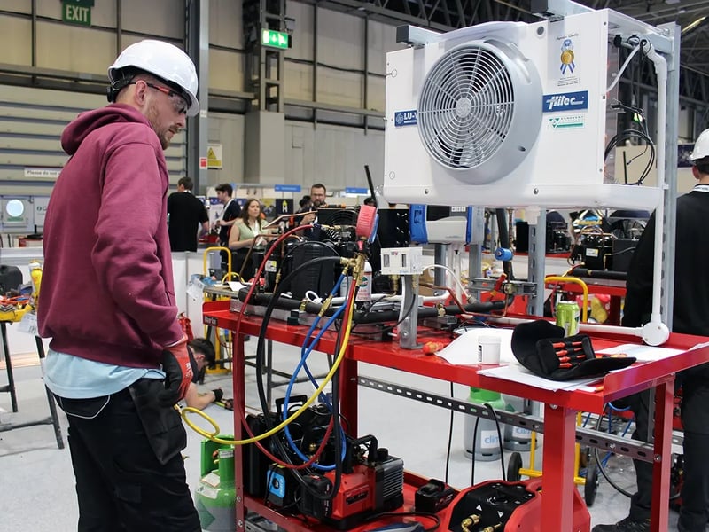Engineer completing practical refrigeration training using HVAC equipment