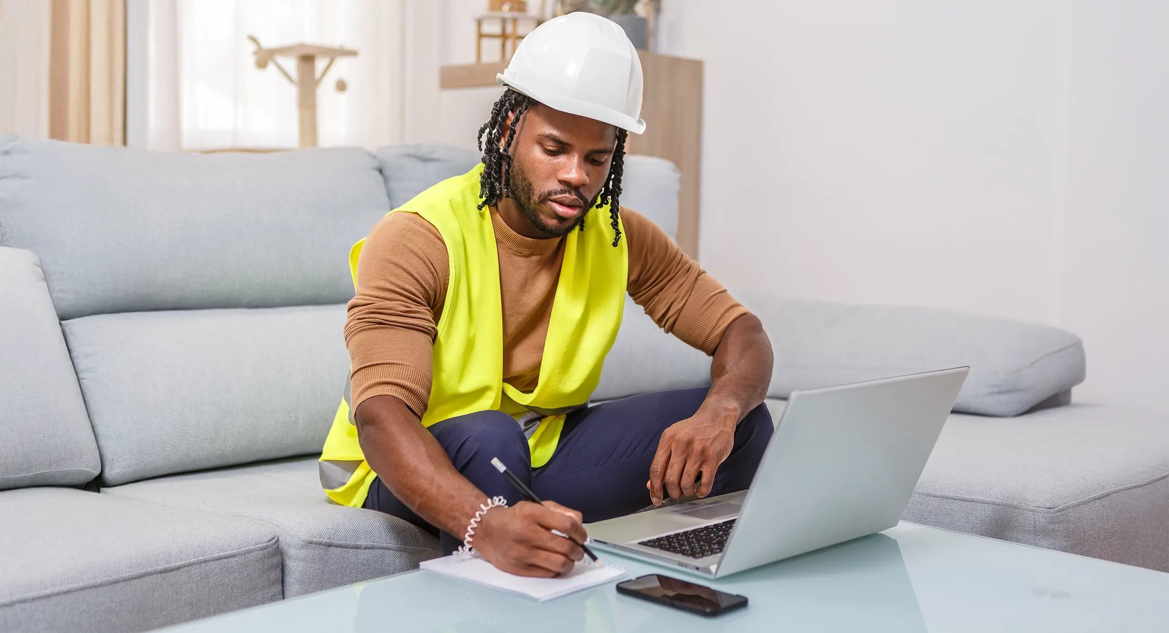 Building services contractor reviewing business cash flow and invoices