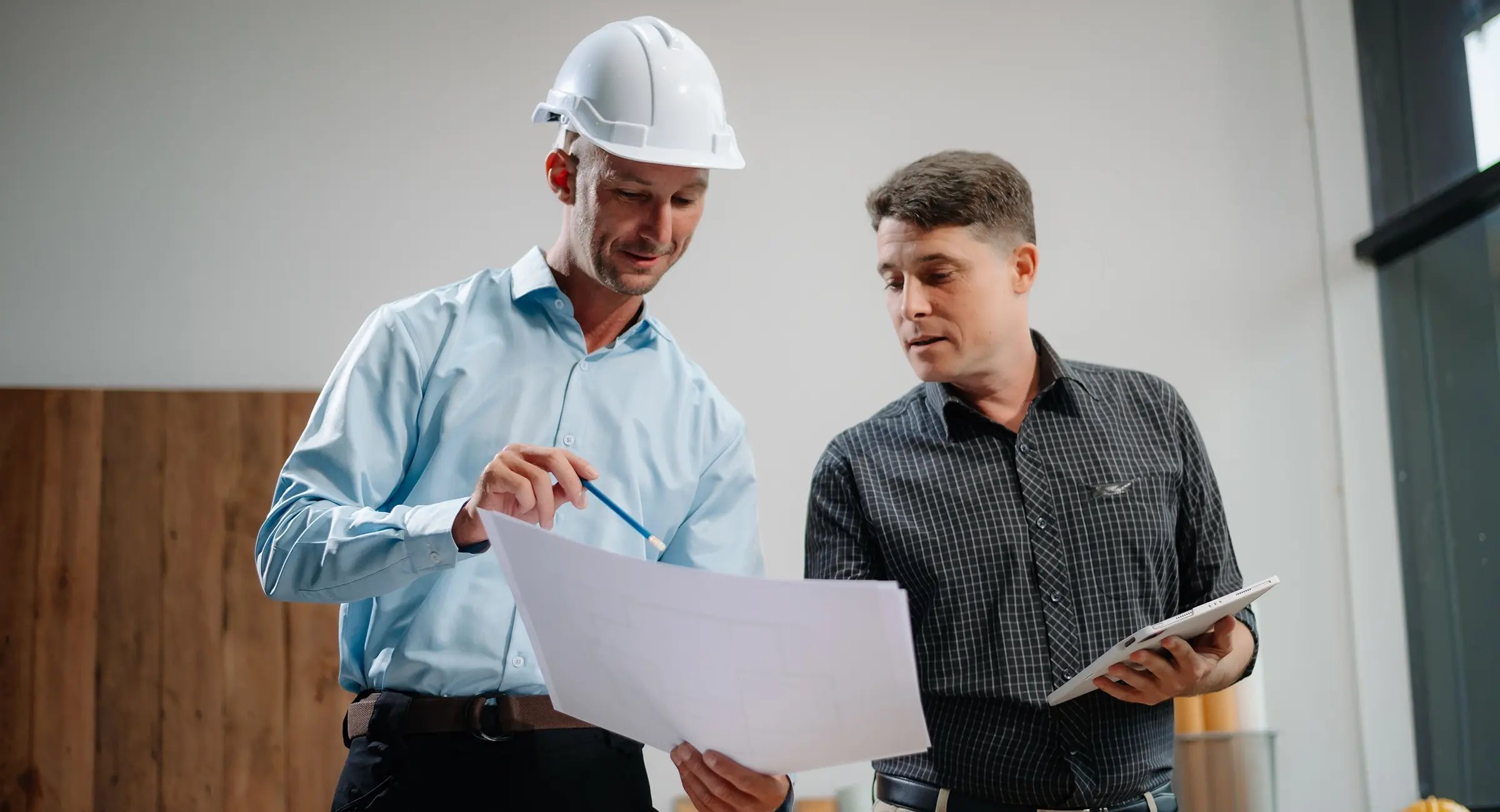 Construction professionals reviewing documents