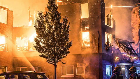 High-rise building on fire representing fire and building safety
