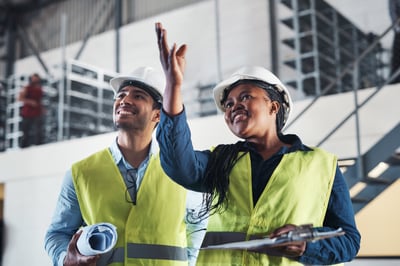 shot-of-two-young-contractors-standing-together-in-2023-11-27-05-11-53-utc