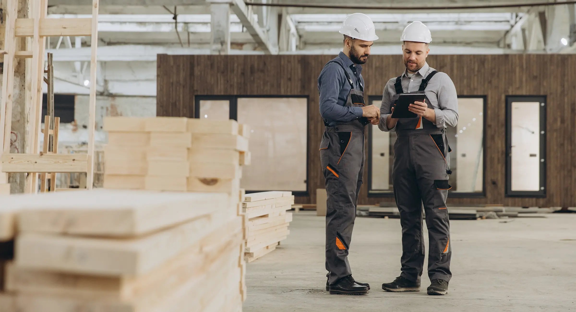 Contractor and supplier reviewing project costs and payment arrangements