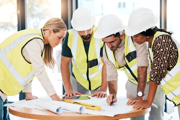teamwork-architecture-engineering-planning-blueprint-office-building-construction-project-meeting-construction-workers-creative-designers-drawing-floor-plan-task-strategy