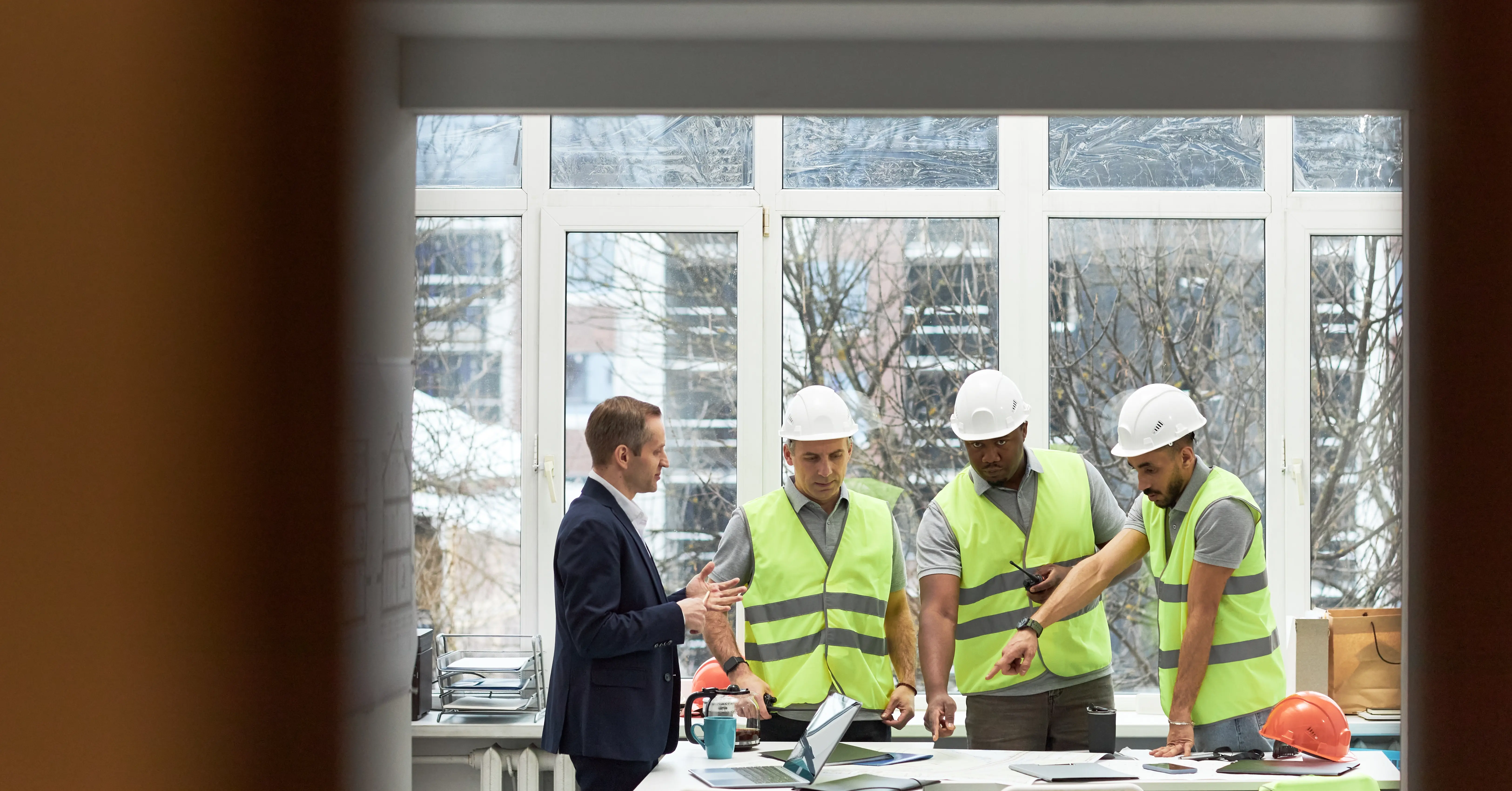 Construction manager briefing building engineering team on employment rights changes