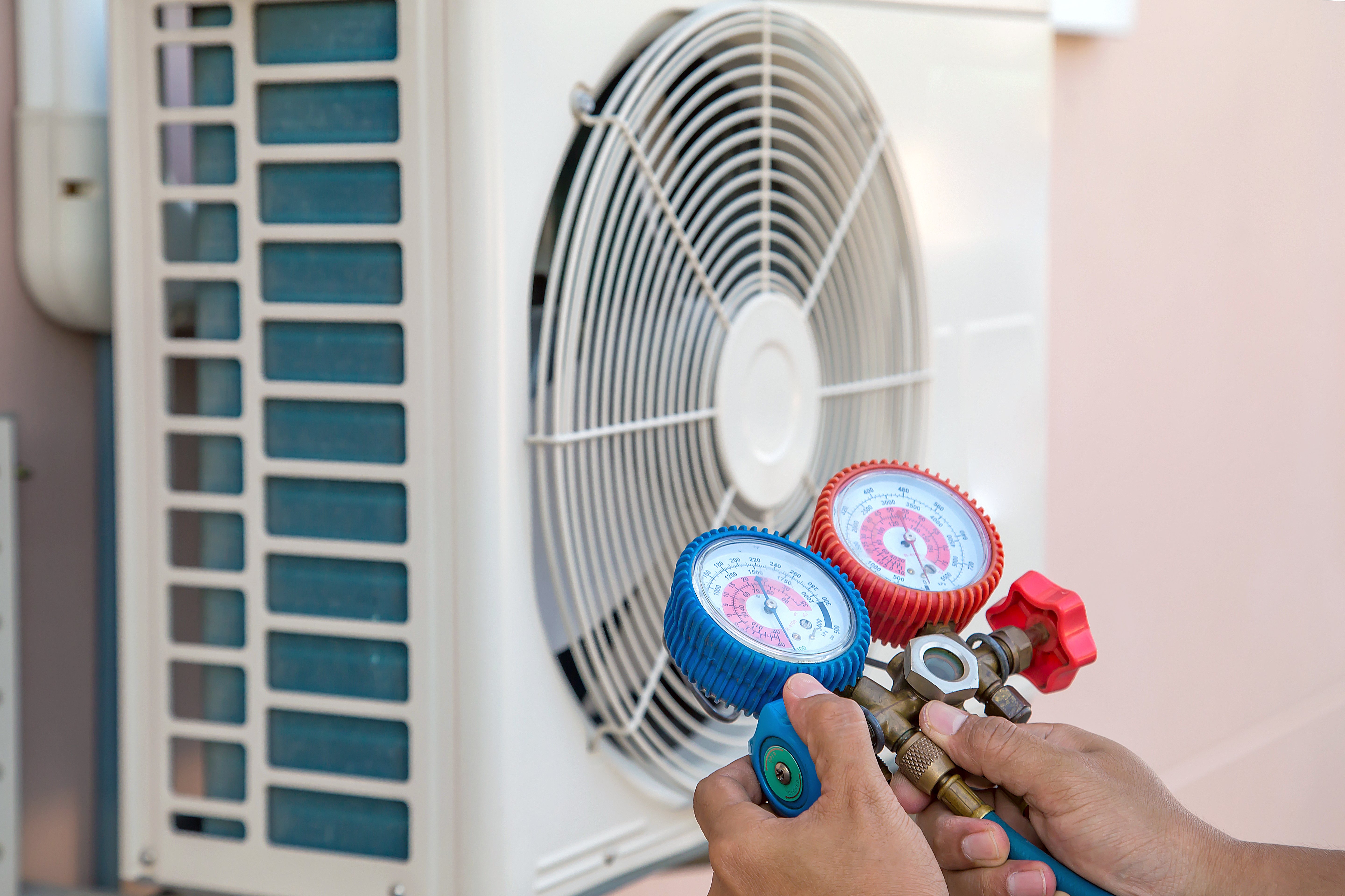 technician-using-measuring-equipment-filling-air-conditioners-checking-outdoor-air-compressor-unit