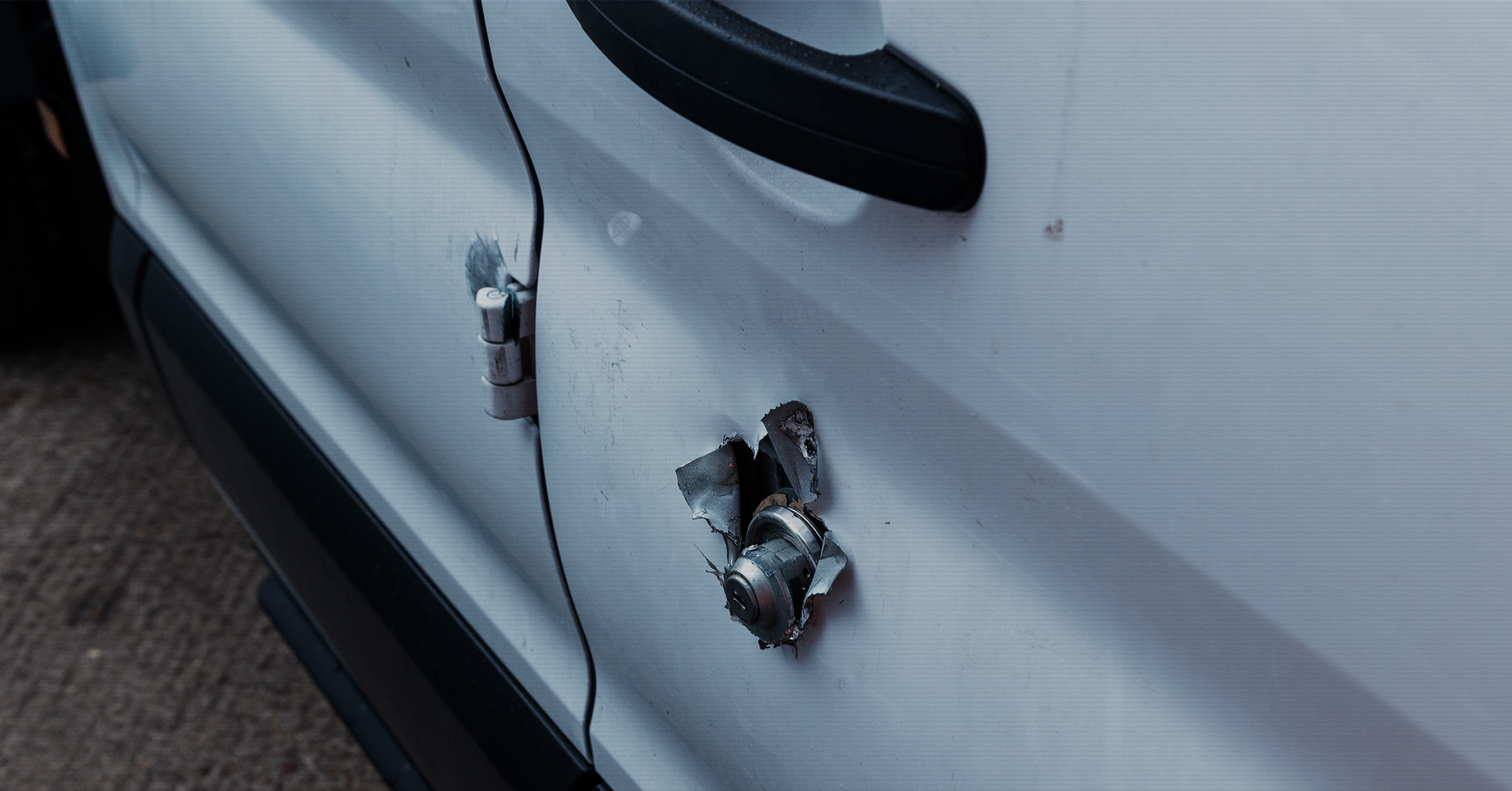 Work van with a broken lock after attempted tool theft, highlighting the risks faced by UK tradespeople.